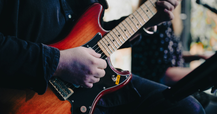 a person is playing the E-Guitar in the chapel of the European Theological Seminary