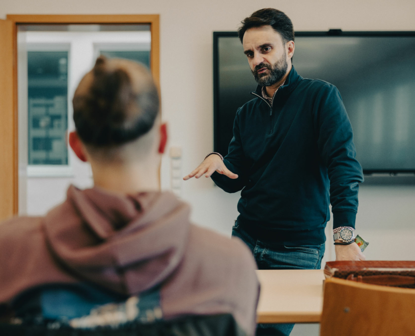 The President of the European Theological Seminary is responding to a question from a student in the classroom.